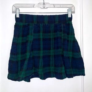 Delia’s plaid skirt